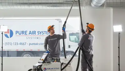 Technician cleaning air ducts for HVAC system in Rochester, NY home