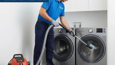 Technician performing professional dryer vent cleaning in Rochester, NY for improved home safety